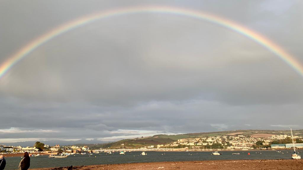 Rainbow with stormy sky