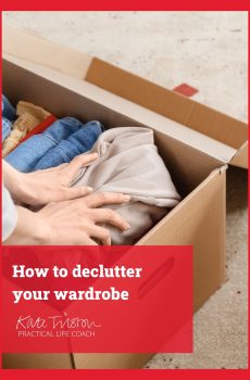A woman organises clothes in a box to help her declutter her wardrobe